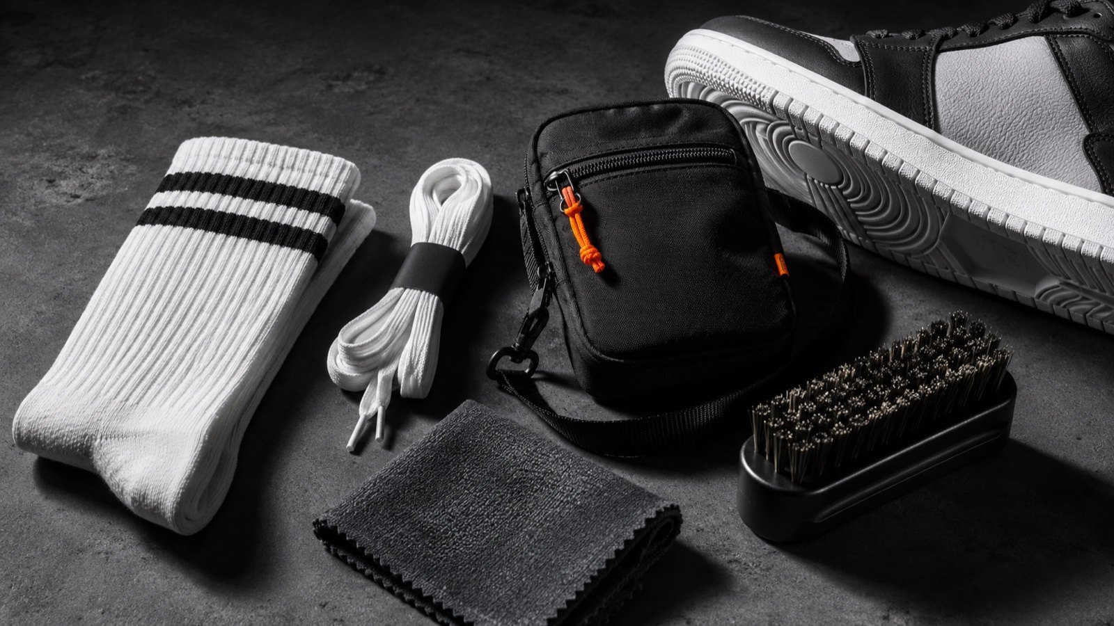 SH SNEAKERS accessories on concrete with crisp streetwear shadows