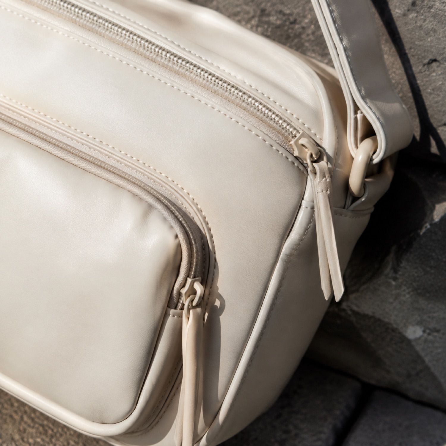 Core compact sling bag — Crossbody Bags by SH SNEAKERS. close detail of the fabric and finish.