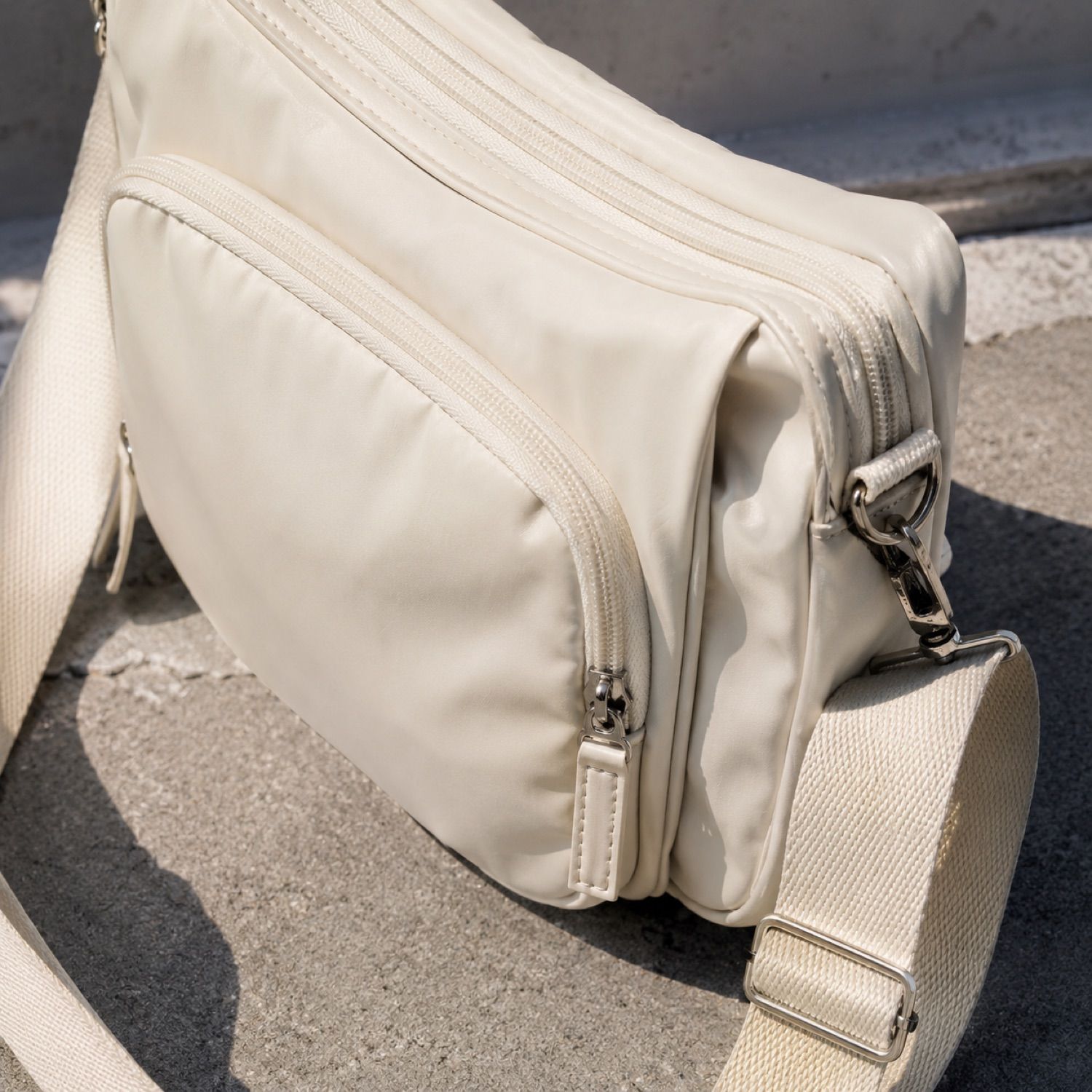 Slate compact sling bag — Crossbody Bags by SH SNEAKERS. close detail of the fabric and finish.
