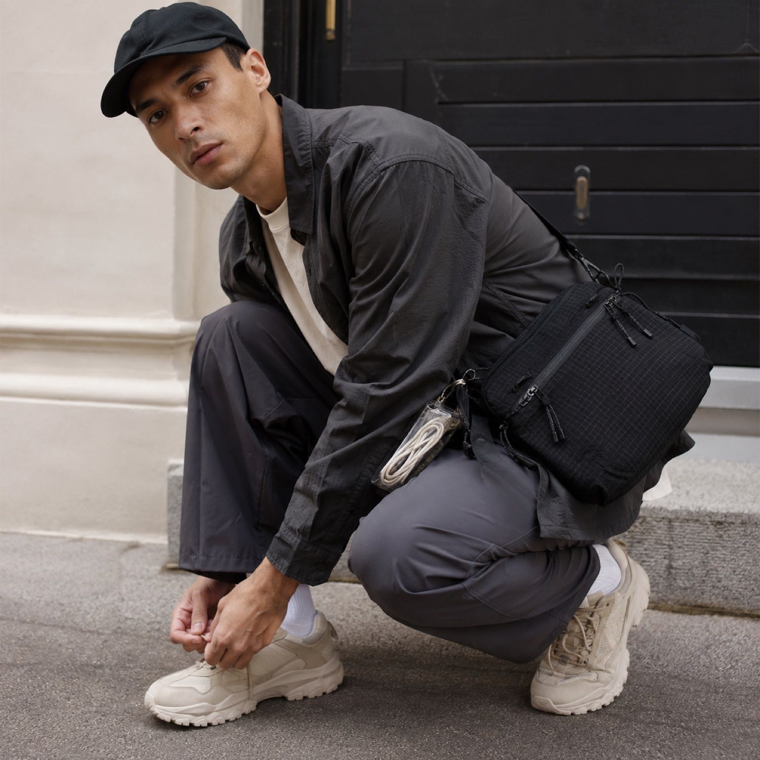 Switch zip utility bag — Crossbody Bags by SH SNEAKERS. worn by a model.