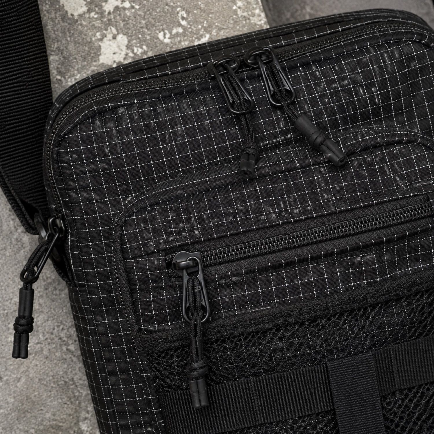 Slate zip utility bag — Crossbody Bags by SH SNEAKERS. close detail of the fabric and finish.